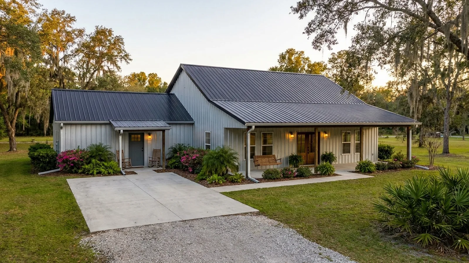 A barndominium with a smaller attached in-law suite wing that has its own separate covered entry, distinct from the main entry.